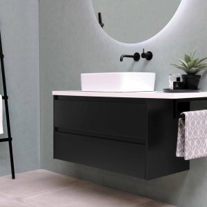 white ceramic bathtub beside white wall